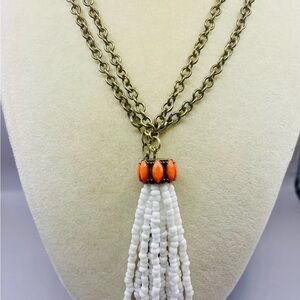 Long Gold and White Bead Tassel Necklace with Orange Topper Beads.